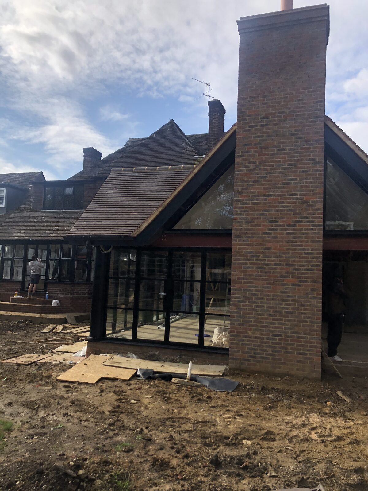 Glazed rear extension with brick chimney breast